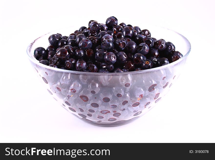 Blueberry close up isolated on white in glass. Blueberry close up isolated on white in glass