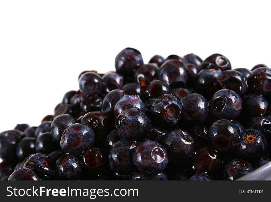 Blueberry close up isolated on white in glass. Blueberry close up isolated on white in glass