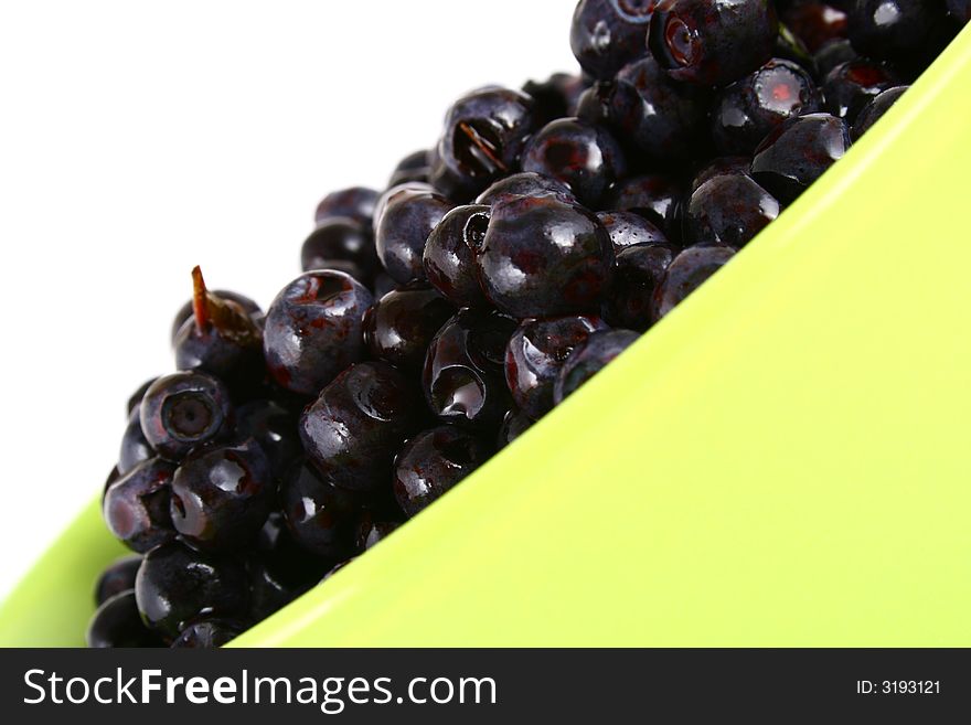 Blueberry close up isolated on white in glass. Blueberry close up isolated on white in glass