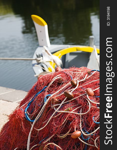 Commerce and industry: red fishing nets and boats