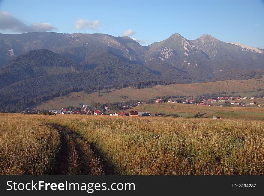 Mountain landscape with village and peaks