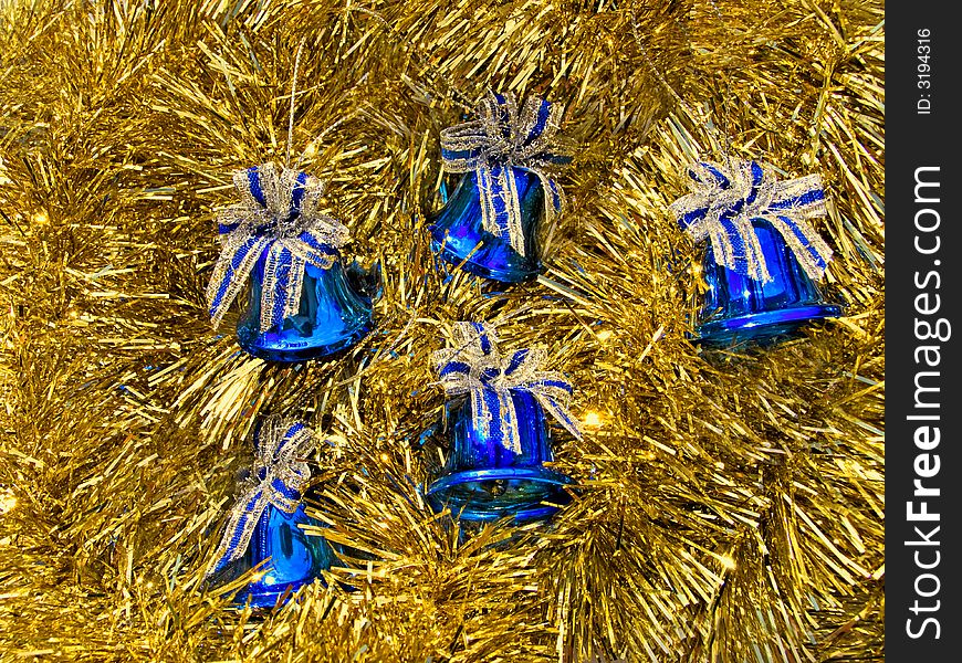 Blue Christmas bells in a golden decoration. Blue Christmas bells in a golden decoration