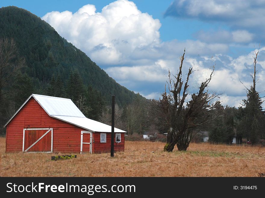 Red Barn With Cloudy Blue Sky