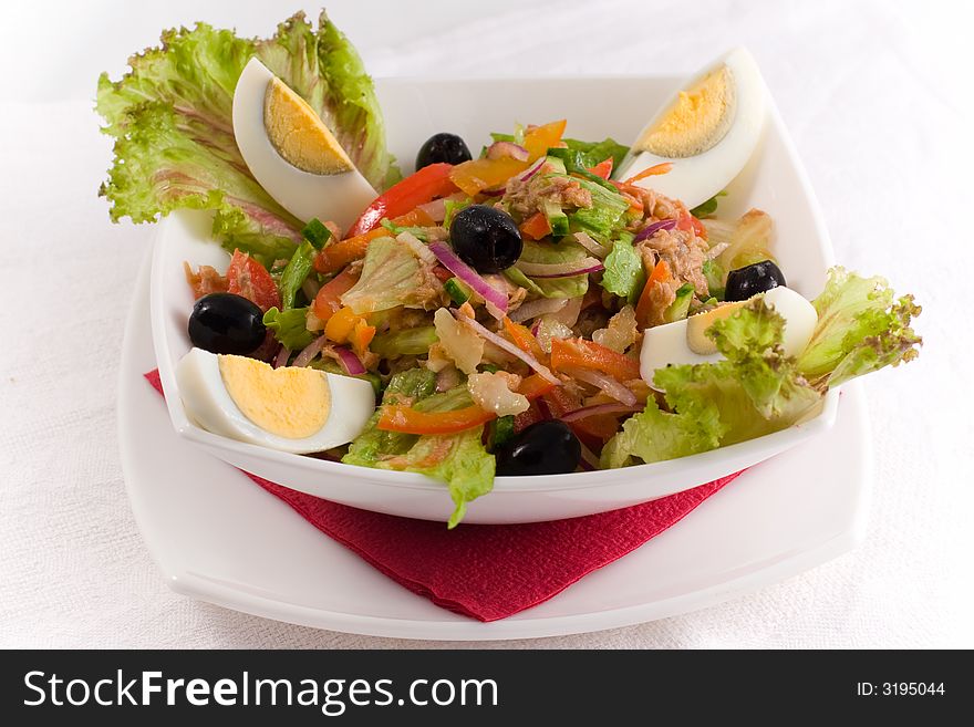 Fresh salad with eggs and olives