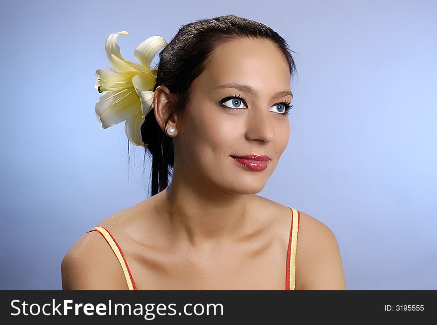 The beautiful girl with a lily in hair. The beautiful girl with a lily in hair