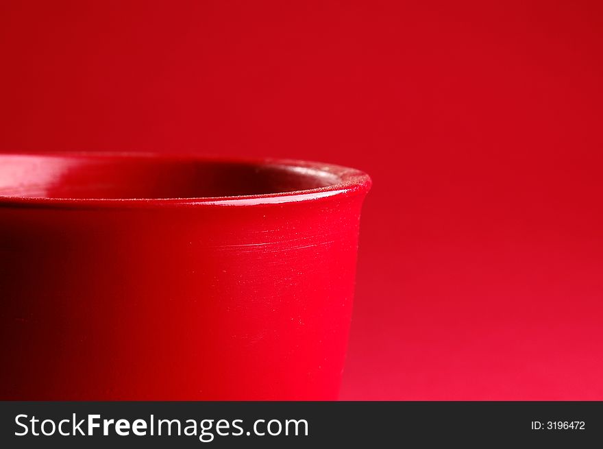 Photo of red vessel isolated on the red background