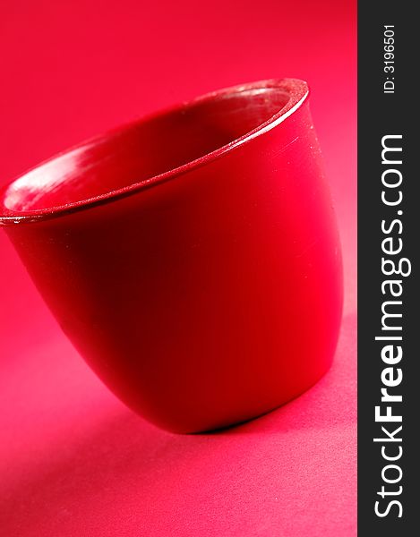 Photo of red vessel isolated on the red background