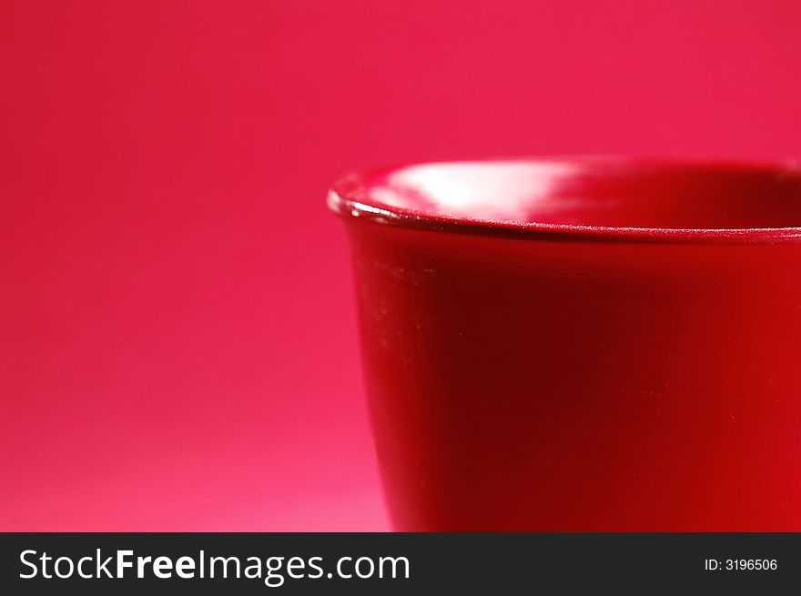 Photo of red vessel isolated on the red background