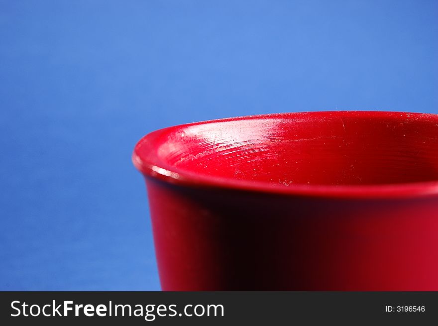 Photo of red vessel isolated on the blue background