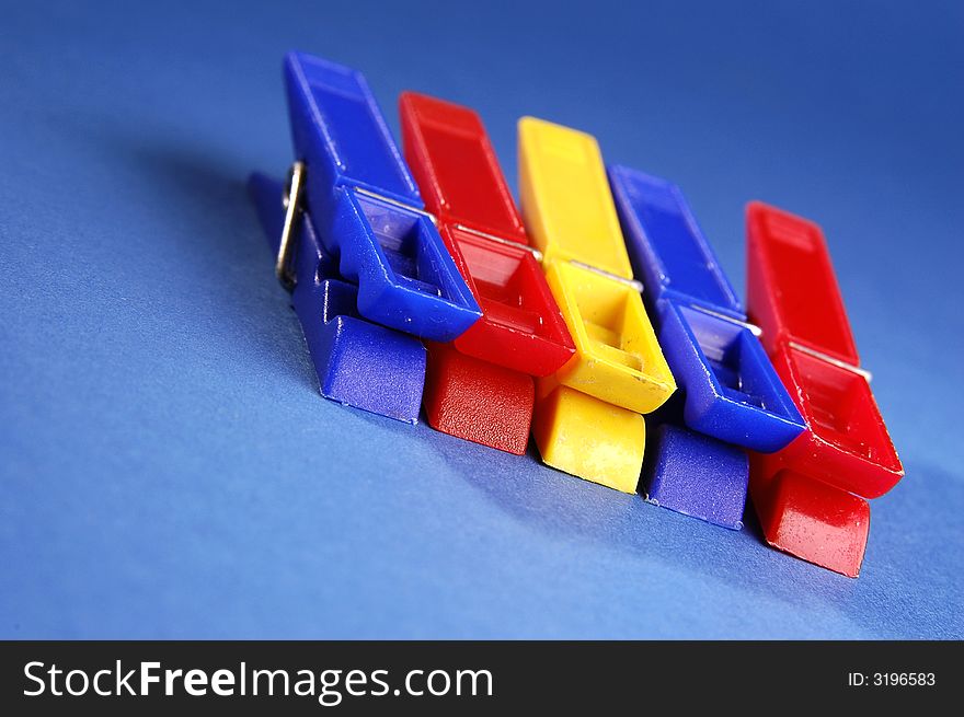 Photo of colorful clips on the blue background