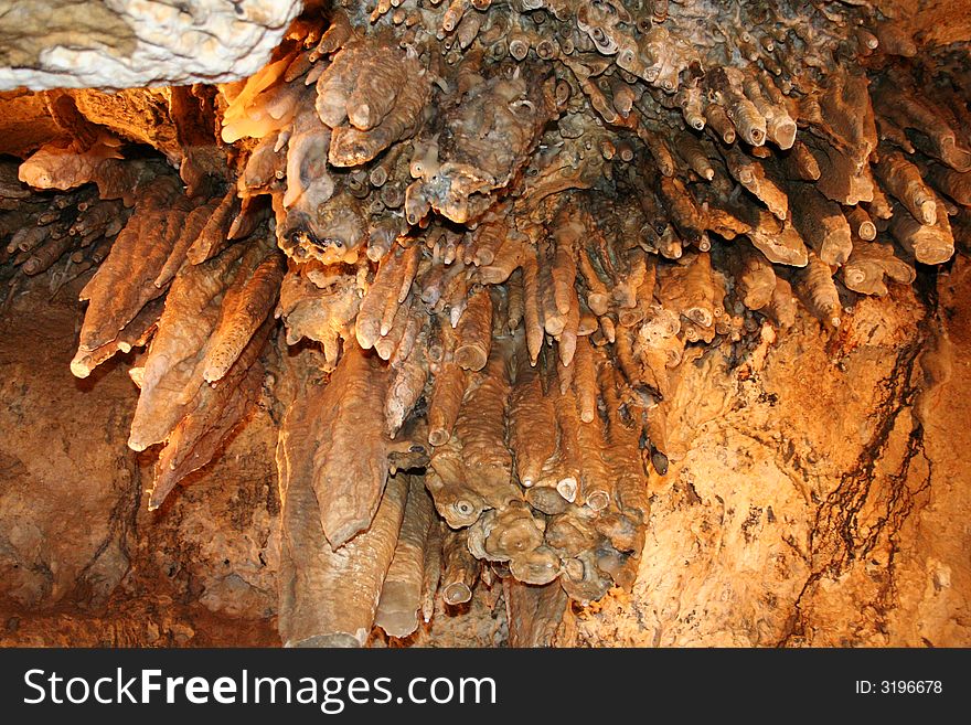 Photo of a group of stalactites in a cave