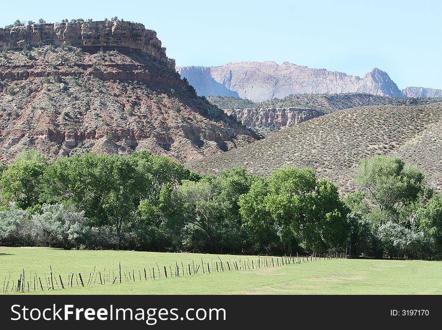 This beautiful pasture landscape is in the southwest united states. It is a working cattle ranch