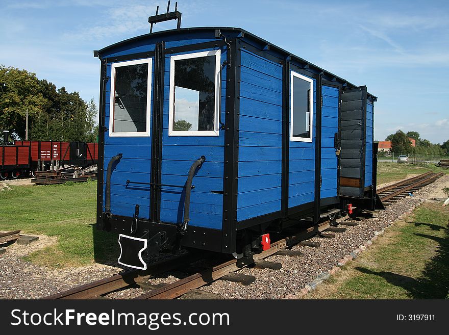 Photo of blue retro train carriage in museum