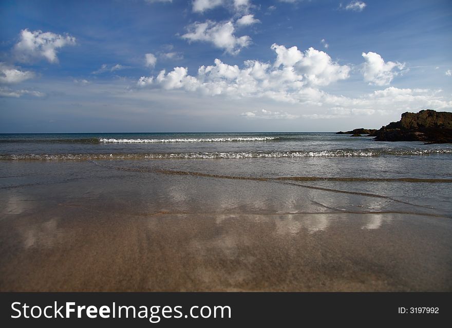 The perfect english sandy beach and cloudy sky