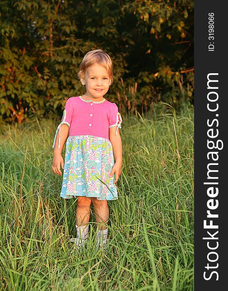 Smiling little girl on grass