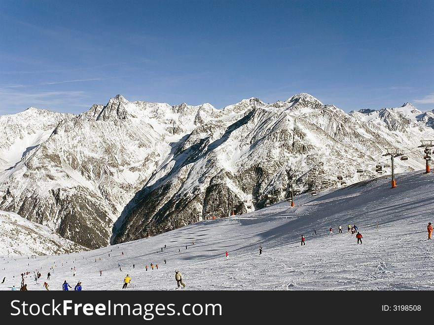 Ski slope of winter Alpine mountains