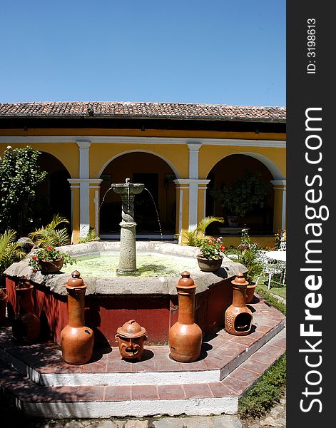 An house with a garden and fountain in the city of Antigua Guatemala. An house with a garden and fountain in the city of Antigua Guatemala