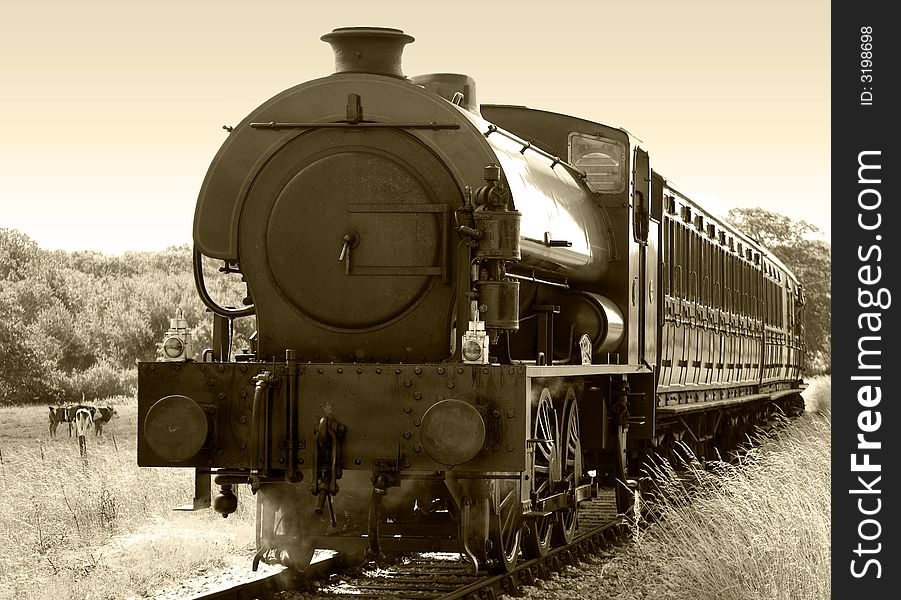 IOW steam train WD198 'Royal Engineer' pulling passenger Carriages. Built in 1953, served at Steventon, Bicester, Long Marston,. IOW steam train WD198 'Royal Engineer' pulling passenger Carriages. Built in 1953, served at Steventon, Bicester, Long Marston,