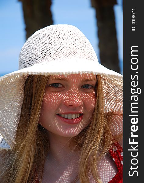 Smile blonde  girl on a white hat. Smile blonde  girl on a white hat