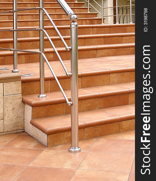 Front staircase with steel railing.