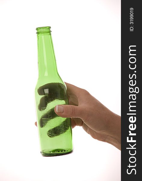 Female hand holding green bottle