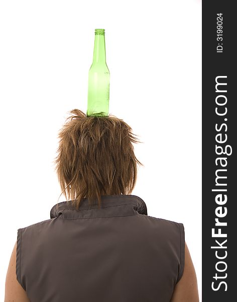 Green bottle balanced on womans head. Green bottle balanced on womans head