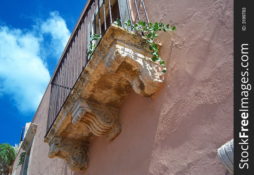 Old balcony on historic building Milazzo, Messina Itali