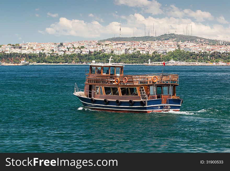 Tourist boat floats along the Bosphorus in Istanbul