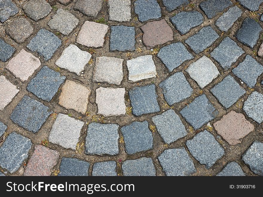 The old multicolored brick floor. The old multicolored brick floor