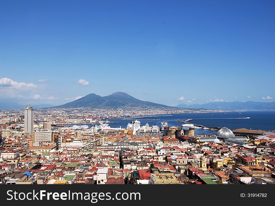 View of Naples with Vesuvius volcano on the background.