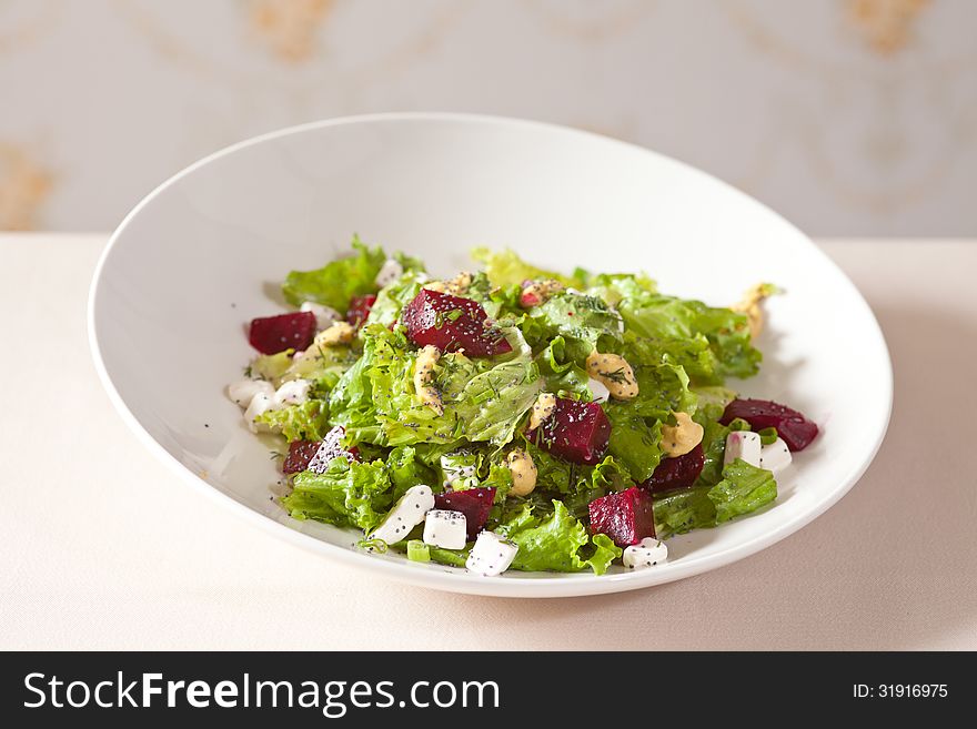 Salad with lettuce feta, mustard and fresh beet. Salad with lettuce feta, mustard and fresh beet