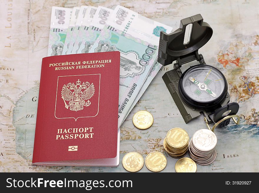 Passport, money and compass.