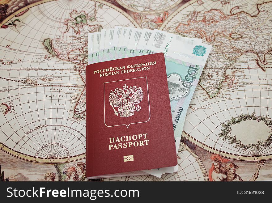 Passport and money . background of the map of the world
