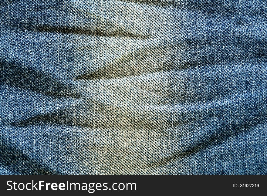 Blue jeans fabric with creased texture. Blue jeans fabric with creased texture