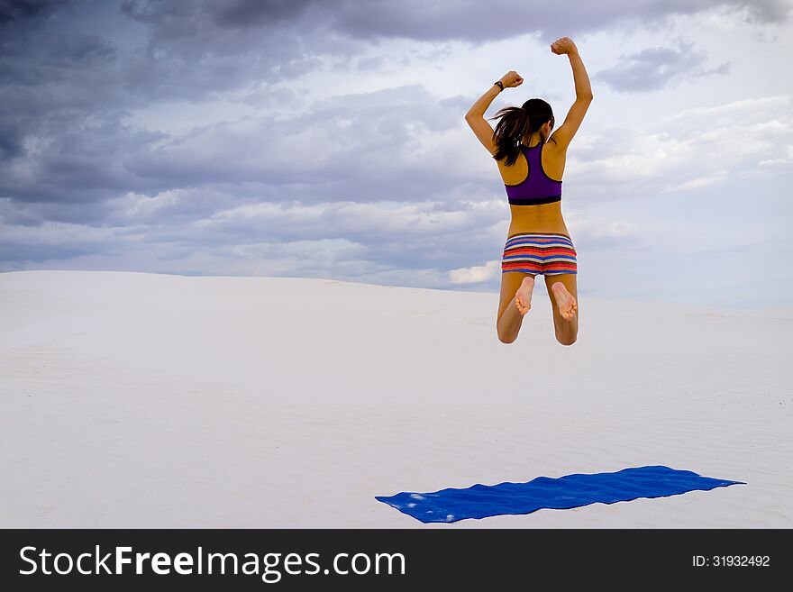 Woman Enjoying Yoga In Secluded Desert Oasis