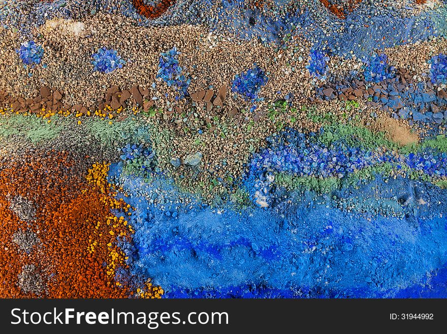 Close up on an abstract background composition made by multicolored sand. Close up on an abstract background composition made by multicolored sand
