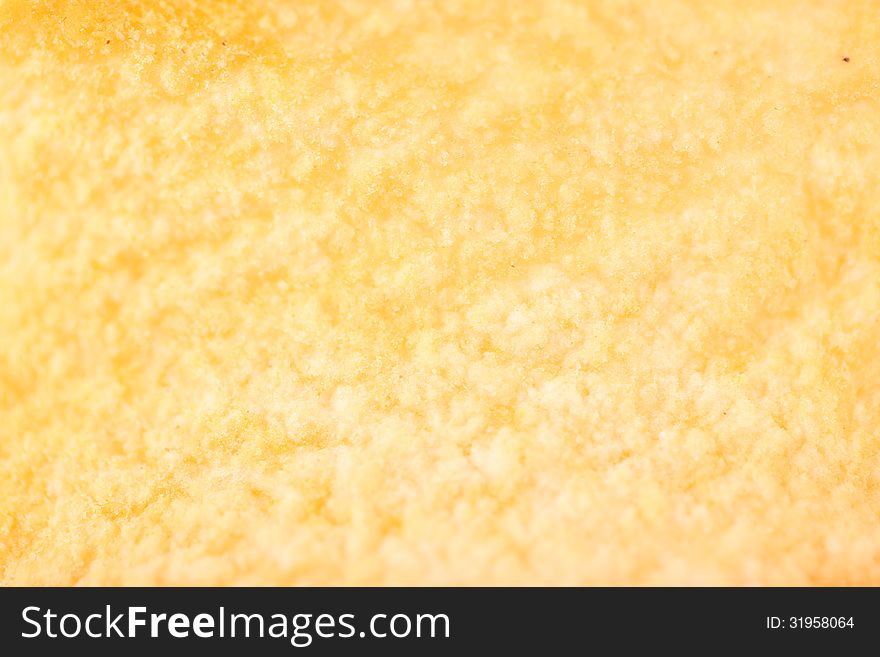 Yellow potato chips closeup on whole background