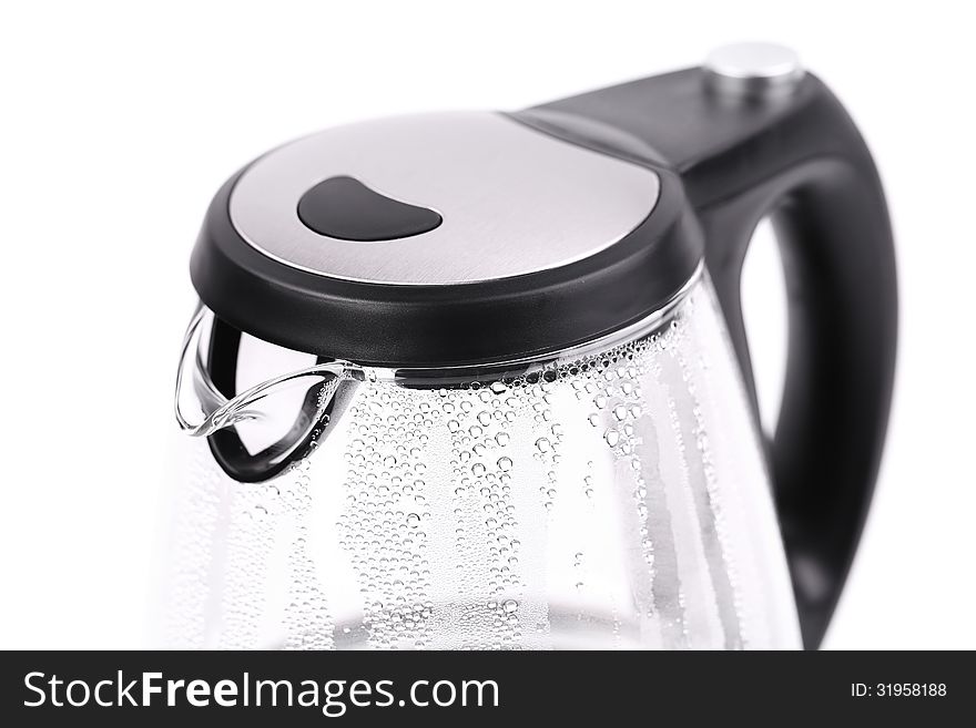 Water boiling in the glass electric kettle.