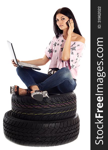 Young girl holding a car wheel, isolated on white. Young girl holding a car wheel, isolated on white.