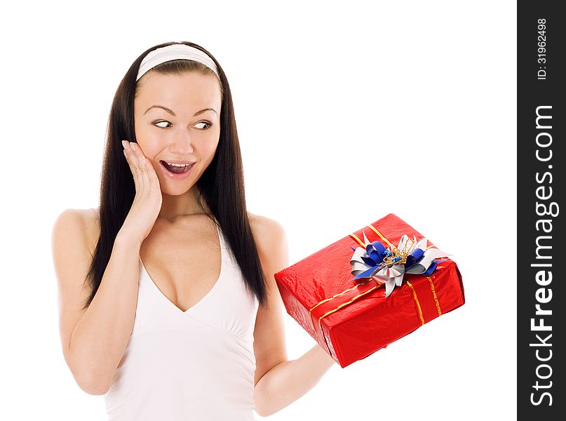 Surprised young woman holding red gift box, isolated on white. Surprised young woman holding red gift box, isolated on white.