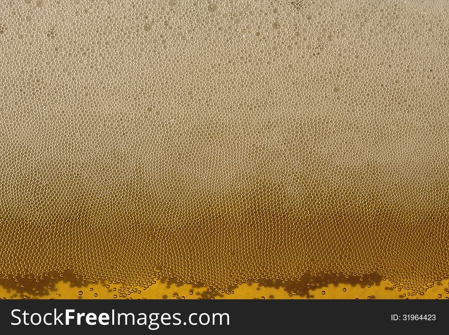 Champagne bubbles of carbon dioxide yellow background