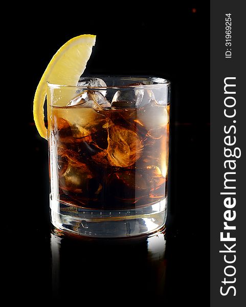 Cocktail with ice cola whiskey