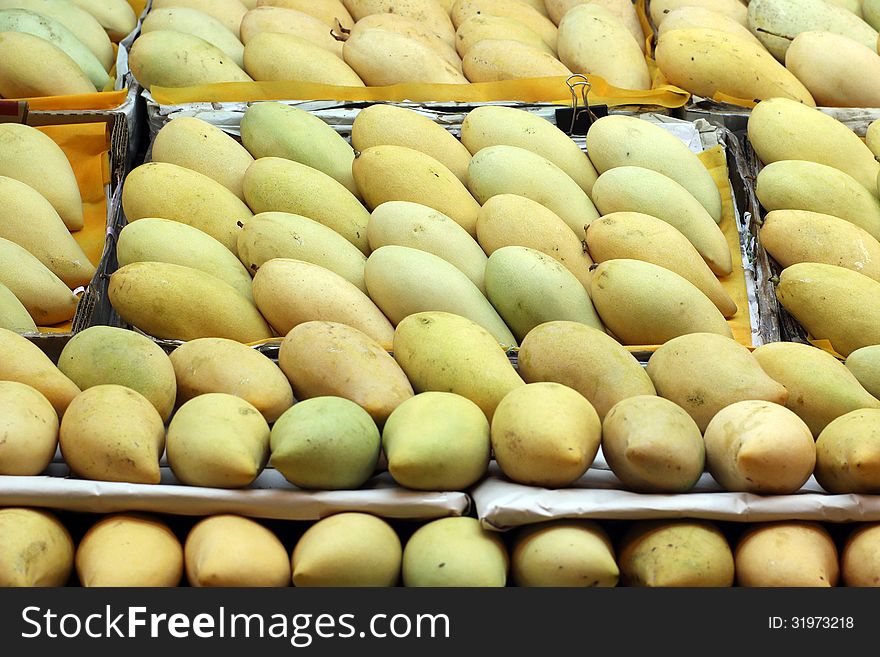 Pile of mango on market tray