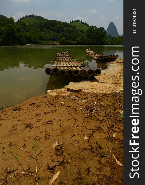 Two abandoned bamboo rafts calm Li river