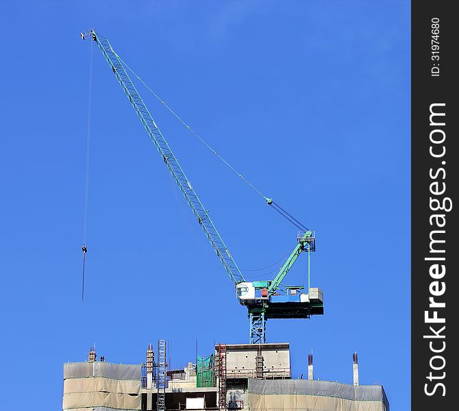 Working crane on construction site