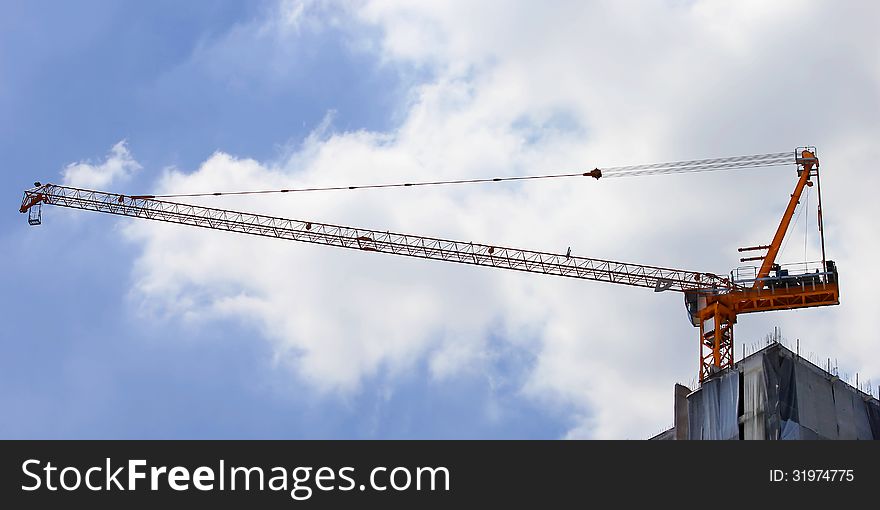 Working crane on construction site