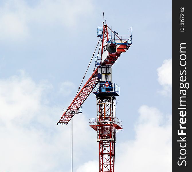 Working crane against beautiful sky