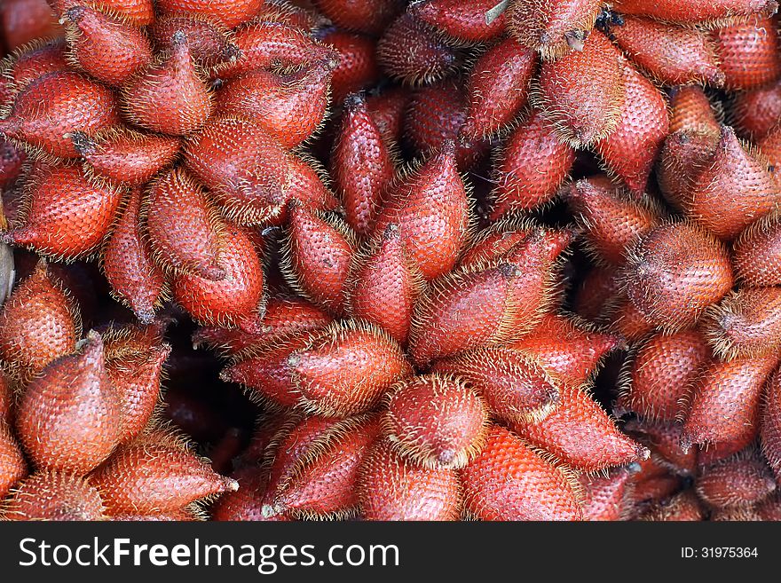 Pile of zalacca on market tray