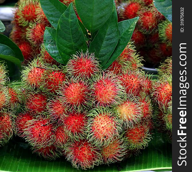 Pile of rambutan on market tray