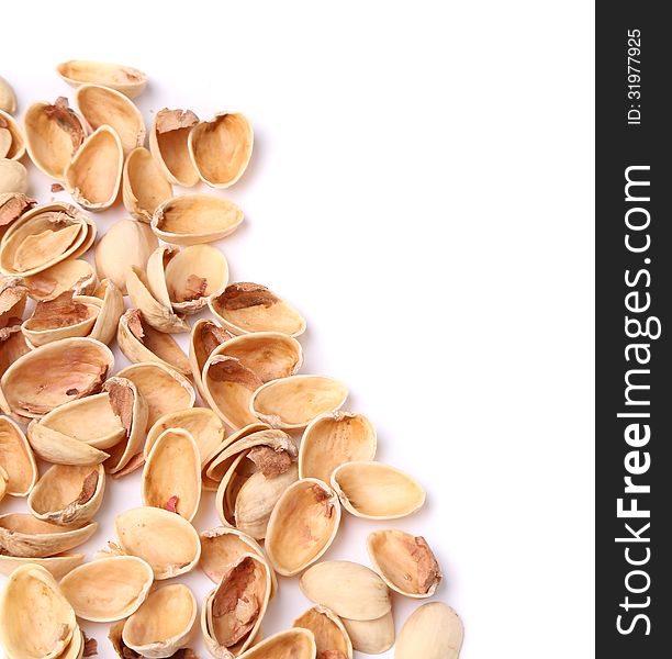 Hull pistachios are located left on a white background